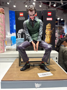 Joker Sitting on Chair Premium Action Figure with Display Base
