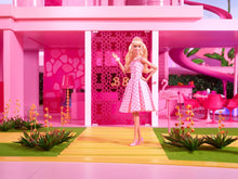 Barbie™ The Movie Doll Wearing Pink and White Gingham Dress with Daisy Chain Necklace