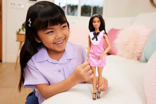 Barbie® Fashionistas™ Doll #209 with Black Hair Wearing a Pink Plaid Dress, Pearlescent Headband and Strappy Heels
